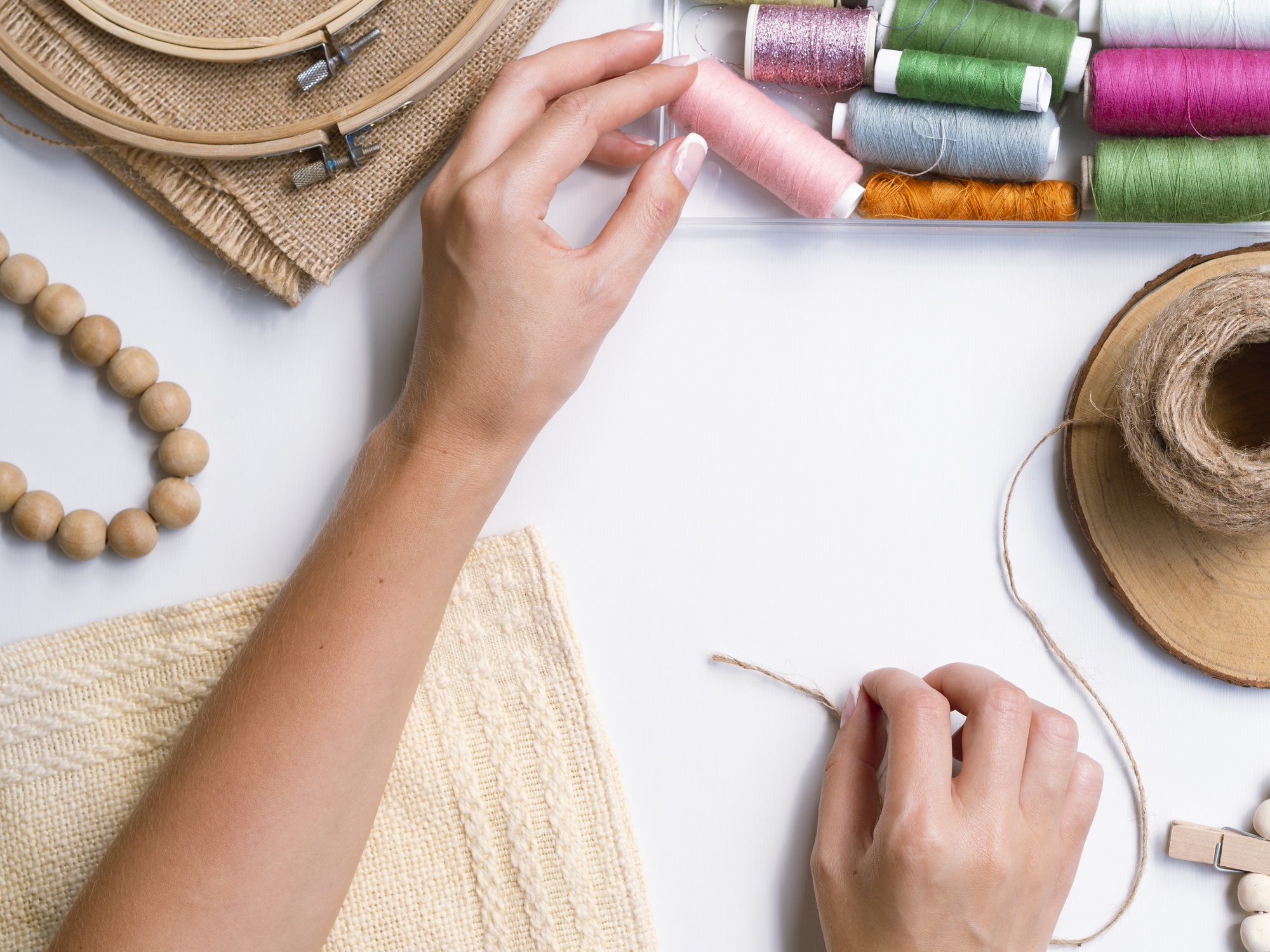 Workshop table with hands embroidering